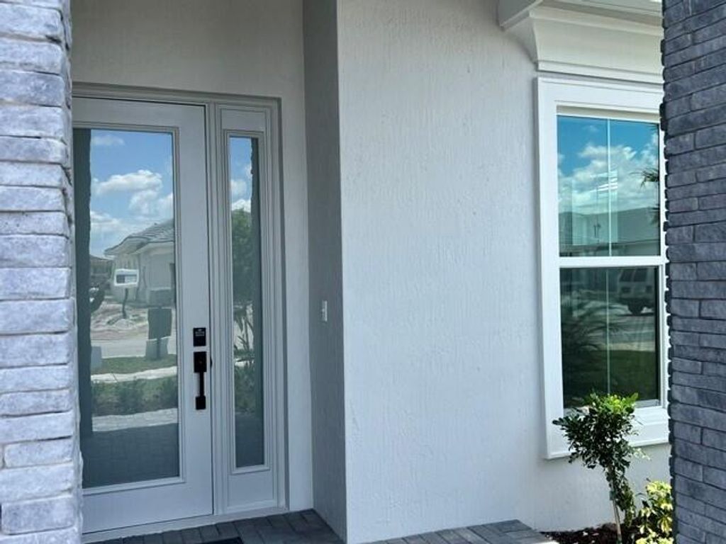 Photo of 10178 Timber Creek Way, Palm Beach Gardens, FL 33412 (MLS # B26026473)