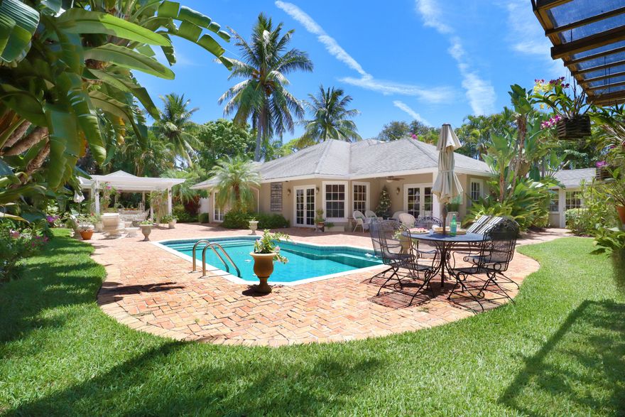 Location + Lifestyle! This private retreat located in the prestigious Palm Trail neighborhood is within four blocks of Atlantic Avenue, and only minutes from the beach and local marina. Purchase now, and enjoy the many charming spaces this home offers for Season 2023! The Chicago brick courtyards and walkways lead to a variety of enchanting areas to entertain in; including covered pergolas and a large, heated pool. Set within a tranquil, oversized lot, and surrounded by many new, multi-million dollar homes, Palm Trail values continue to rise. There is plenty of square footage, with opportunity to reimagine your very own design on this beautiful, corner lot.