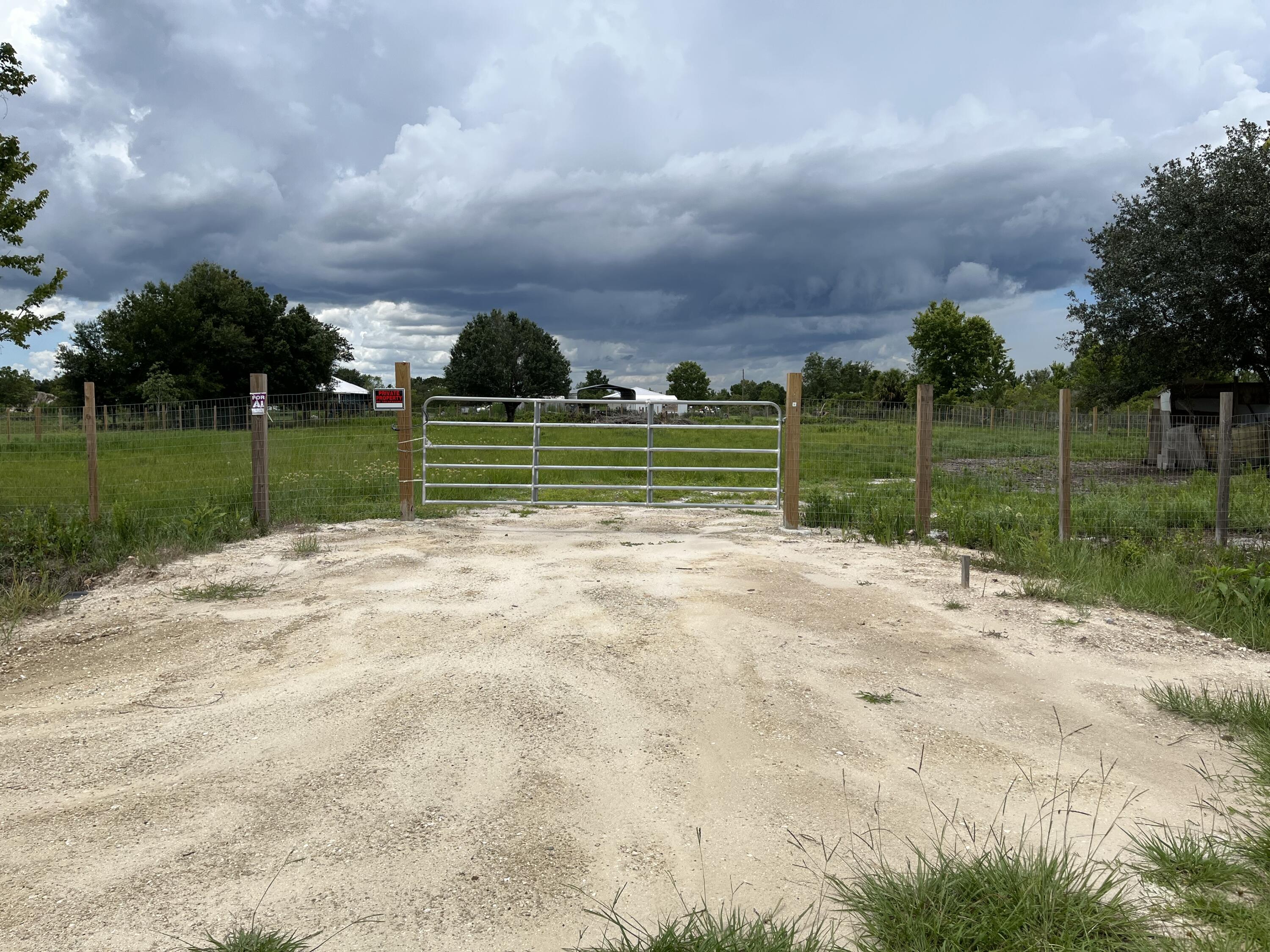 Build or bring your dream home and barn on this beautiful and private high and dry 1.25 acre fenced with an entrance gate cleared and culvert already in place just off of the main paved road but yet still private. with Power poles in front of the property .So much to enjoy in Okeechobee County. Come to The Kissimmee River Preserve State Park West of this area as well is the Kissimmee River. The Kissimmee River flows into Lake Okeechobee and is well known for some of the best fishing. whether you like Fishing, hunting, mudding agriculture or just privacy here you have it all.