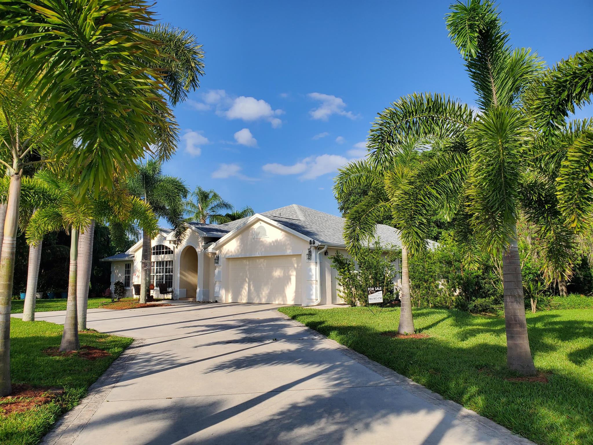 Welcome to our desirable, well-established Oleander Pines community! This is the home you've been waiting for! Breathtaking lakefront view from nearly every room, with a .282 oversized corned lot. This home features BRAND NEW ROOF (5/25), BRAND NEW A/C and HEATING SYSTEM (11/24), BRAND NEW RHEEM WATER HEAT UNIT (11/24). This CONCRETE BLOCK HOME has a beautiful porcelain tiles throughout the home. with a beautiful NEW KITCHEN with soft close doors & 36'' cabinets, 10+ ft. island and quartz countertop, stainless steel appliances (2024) with spacious open concept design perfect for gathering. The property is very private and surrounded by conservation land. The primary suite is HUGE with two very large walk-in closet and conveniently open to your private backyard oasis, with vaulted ceiling
