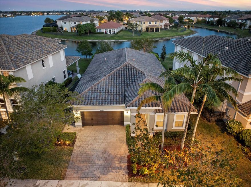 LOWEST PRICED NEWER CONSTRUCTION HOME IN ALL OF PARKLAND! 4 Beds, 3 Baths Waterfront Home w/Impact Windows & Doors & On Gas! Spacious Fenced-In Yard w/Room For Pool, Extended Pavered Patio Area. Large Primary Bed w/Walk-In Closets & Sitting Area. Master Bath w/Separate Jetted Tub/Shower, Dual Sinks, Granite Counters. Open Floor Plan, Engineered Wood Floors & Newer A/C Unit. Gorgeous Foyer Entry w/Crystal Chandeliers & Wainscoting Panels, 4th Bed Has Its Own On-Suite Bath, Open Kitchen w/Granite Counters, Custom Window Treatments, Plantation Shutters & Light Fixtures, 2-Car Garage w/Track System For Storage & Extra Overhead Storage, Crown Molding Throughout. Tankless Water Heater, Dryer, & Cooking All On Gas. Prestigious Guard Gated Community w/Resort Style Amenities, A-Rated Schools.