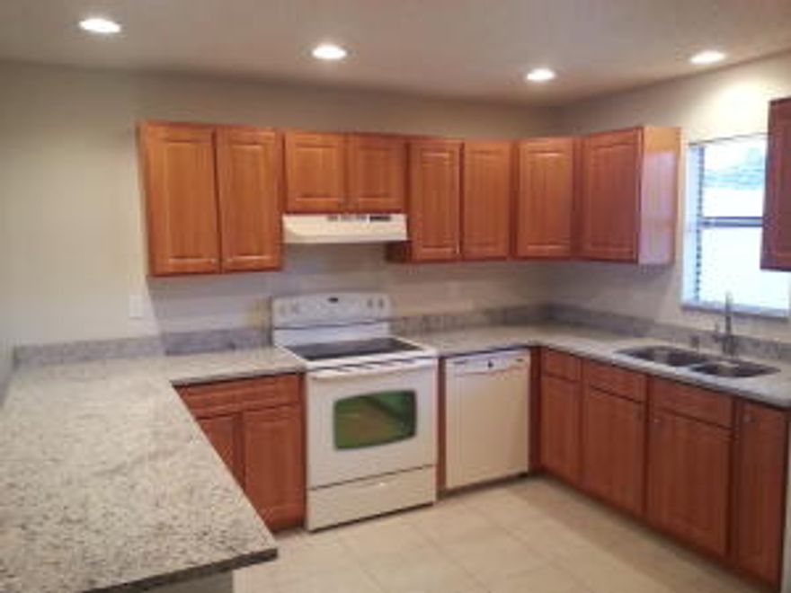 REDUCED PRICE !! FHA WELCOME !! WON'T LAST !! REMODELED BEAUTIFUL HOME * MOVE-IN CONDITION * BUILT IN 1989 - UPGRADED KITCHEN with granite counter tops, NEW BATHROOM, NEW TILE FLOORS, COUNTY WATER (Seller paid in full the connection !!), NEW STUCCO all around the house, fresh paint inside and out, new doors, new driveway, new pavers in the back, new fence (fully fenced backyard), upgraded electric installation (even the closets have light !!!), new light fixtures, new security lights, upgraded plumbing, etc, etc, etc. This house is next to a small park which makes it even more attractive (please see photos - aerial view). It still has the well pipe (may add a pump and use it to irrigate the yard). The roof has been properly repaired and has no leaks. MUST SEE PROPERTY - DON'T MISS IT !!