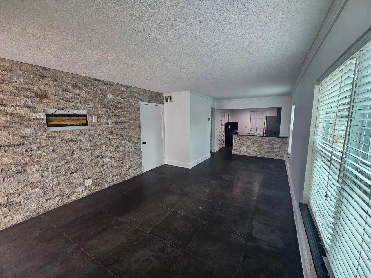 Spacious 2-Bed, 2-Bath Condo in Prime Davie Location!Welcome to this beautifully updated condo in the heart of Davie! This spacious 2-bedroom, 2-bath unit has been freshly painted and features elegant porcelain tile flooring throughout. The kitchen and bathrooms have been thoughtfully updated, offering a modern touch with clean finishes. Enjoy year-round comfort with a newer A/C system. Newly installed Impact Windows.Perfectly located near the Seminole Hard Rock Hotel & Casino, major highways, shopping centers, dining, and entertainment, this unit combines convenience with comfort. Whether you're a first-time buyer, downsizing, or looking for a great investment, this condo checks all the boxes!