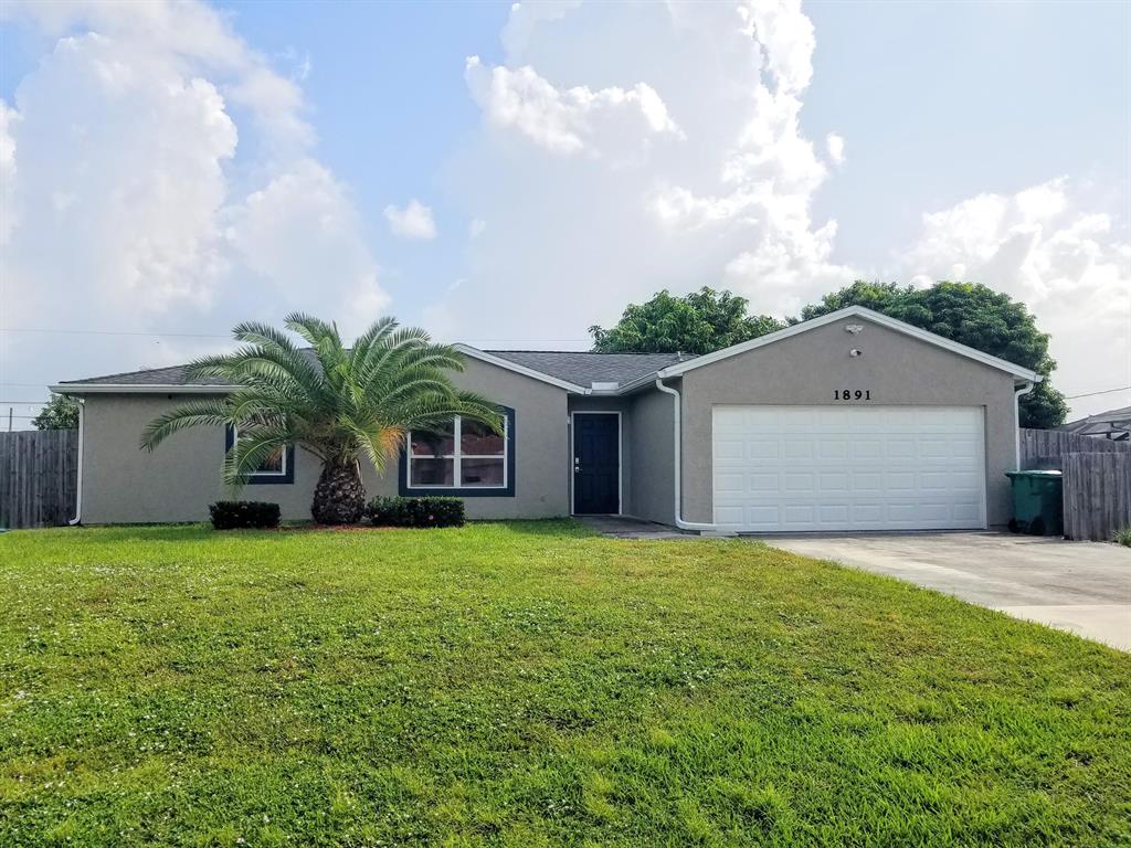 MUST SEE this Custom Renovated 3/2/2 Home, with Hugh fenced Yard. Featuring New Kitchen with Granite Counter Tops, Tiled Backsplash, and S.S. Appliances, Full Tile Floors throughout, Custom LED Lighting, New Bathrooms, Privacy Fence, and a Mango Tree to Boot. This House is Energy Efficient, with New A/C, and Water Heater. Home Shows PRIDE of Ownership, and Owner is Looking for Someone who will Treat it Like their Own. Call Today for your private Showing.