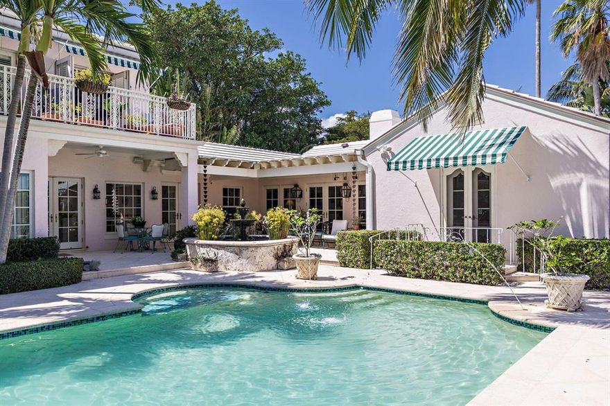 ''Palma Rosada'' Private Gated El Cid Estate 
This 1939 Maurice Fatio designed, secluded Hollywood Regency style estate, was completely restored and expanded in 2009. Enjoy breathtaking sunrises and sweeping Intracoastal water views of Tarpon Cove islands and Everglades Island from the two spacious balconies off the second level master bedroom of this +/- 13,550 sqft property. Interiors designed by Leta Austin Foster. The beautiful flow provides room for discovery and imagination to meander through this sprawling 5 bedroom 5.1 bath house with a private courtyard and garden with wrap around views. Ideal for private outdoor entertaining. Versatile floor plan with first and second level master bedrooms. Thoughtfully appointed with high level custom luxurious finishes, this home exemplifies t gracious living of the glamorous bygone Palm Beach era. Fully updated with all the modern luxuries, including, custom hurricane impact windows and doors, numerous built in bookshelves, laundry room, private study, Chef's kitchen with Viking side by side refrigerator/freezer, custom cabinetry and rare Wenge wood island and custom Terazzo flooring. French doors from Through the first floor master bedroom's French doors your lead onto a Juliette patio overlooking the back garden and 40' pool and spa. A swimmer's paradise, designed by a swimmer. Additional features include, Historic copper awning over front door, Historic wrought-iron gates which were mechanized, surround sound throughout the home, two large master closets, outdoor cabana shower, vibrant fish pond with fountain in courtyard and oversized 1- car garage, coral stone walkways and gas lamps. Walking distance to Palm Beach Day Academy.