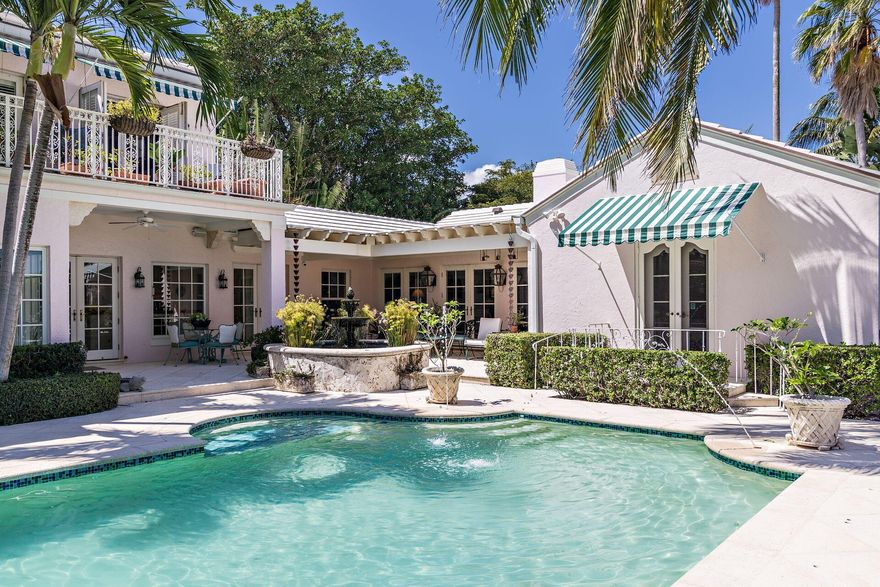 ''Palma Rosada'' Private Gated El Cid Estate 
This 1939 Maurice Fatio designed, secluded Hollywood Regency style estate, was completely restored and expanded in 2009. Enjoy breathtaking sunrises and sweeping Intracoastal water views of Tarpon Cove islands and Everglades Island from the two spacious balconies off the second level master bedroom of this +/- 13,550 sqft property. Interiors designed by Leta Austin Foster. The beautiful flow provides room for discovery and imagination to meander through this sprawling 5 bedroom 5.1 bath house with a private courtyard and garden with wrap around views. Ideal for private outdoor entertaining. Versatile floor plan with first and second level master bedrooms. Thoughtfully appointed with high level custom luxurious finishes, this home exemplifies t gracious living of the glamorous bygone Palm Beach era. Fully updated with all the modern luxuries, including, custom hurricane impact windows and doors, numerous built in bookshelves, laundry room, private study, Chef's kitchen with Viking side by side refrigerator/freezer, custom cabinetry and rare Wenge wood island and custom Terazzo flooring. French doors from Through the first floor master bedroom's French doors your lead onto a Juliette patio overlooking the back garden and 40' pool and spa. A swimmer's paradise, designed by a swimmer. Additional features include, Historic copper awning over front door, Historic wrought-iron gates which were mechanized, surround sound throughout the home, two large master closets, outdoor cabana shower, vibrant fish pond with fountain in courtyard and oversized 1- car garage, coral stone walkways and gas lamps. Walking distance to Palm Beach Day Academy.