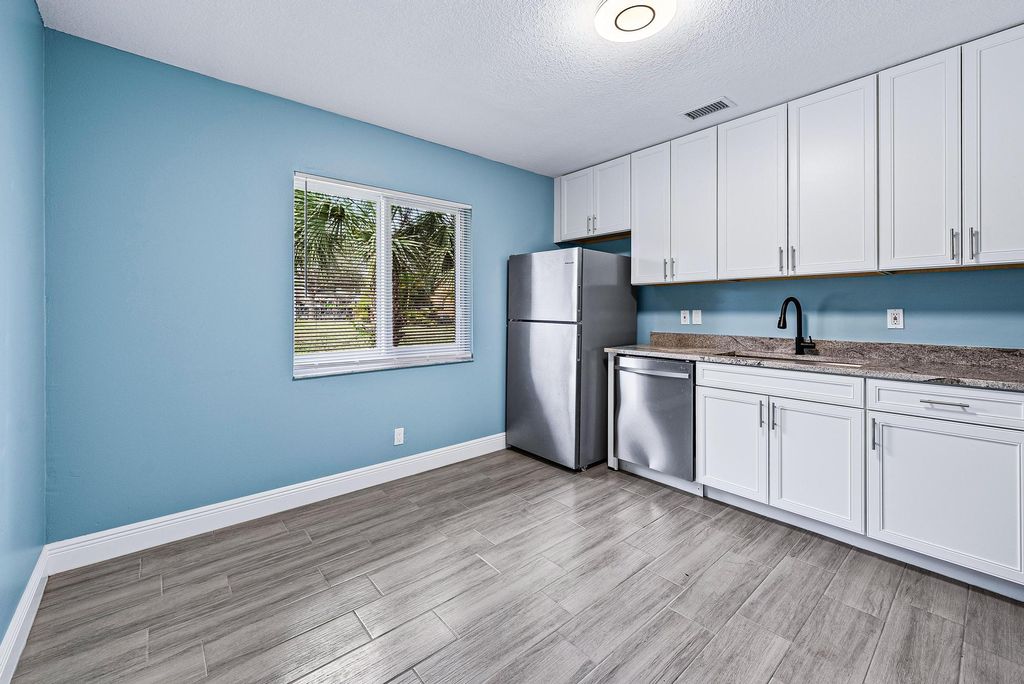 Photo of 9077 W Highland Pines Boulevard, Palm Beach Gardens, FL 33418 (MLS # R10957613)