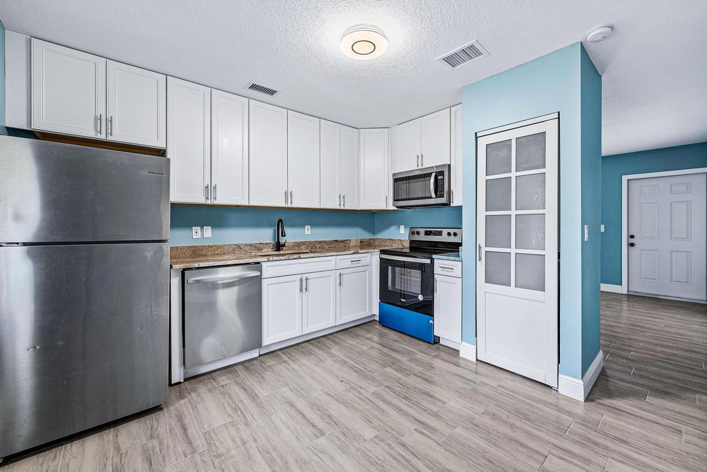 Photo of 9077 W Highland Pines Boulevard, Palm Beach Gardens, FL 33418 (MLS # R10957613)