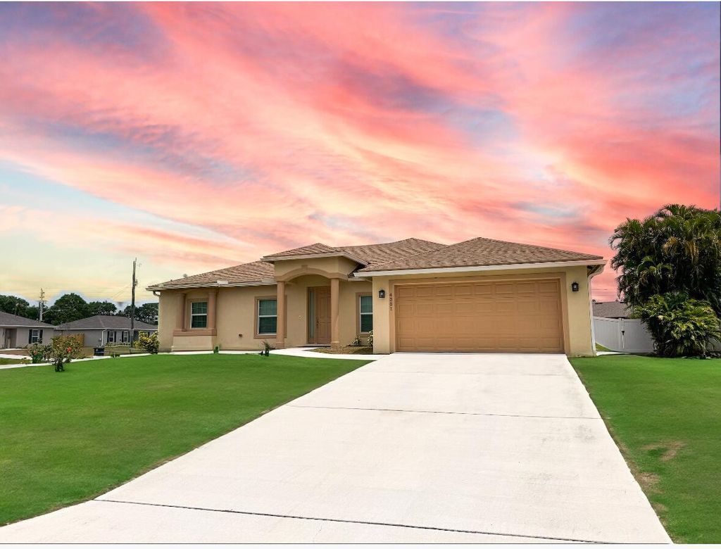 Photo of 4201 SW Mcclellen Street, Port Saint Lucie, FL 34953 (MLS # R10983105)