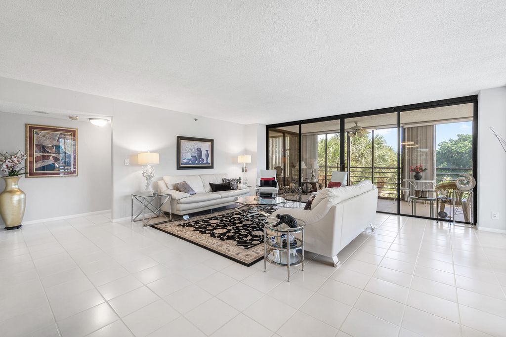Photo of 7572 Regency Lake Drive #401, Boca Raton, FL 33433 (MLS # R11130039)