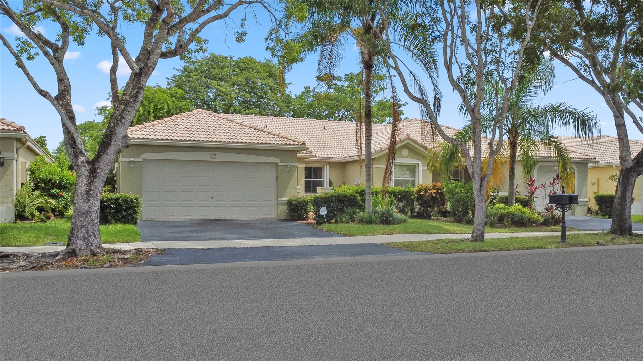 Beautiful 3BR 2 Bath Weston Home in The Ridges! 24-Hour Guard Gated Community! Courtyard Entry with Attractive Foyer Area! Bright Open Floor plan with Volume Ceilings & Split BR Layout! Spacious Kitchen with Breakfast Area, Large Pantry, Granite Counter Tops, Stainless Steel Appliances Including New Kitchen Aid Silent Dishwasher! Nice Private Screened Patio Off Living Room with Sliding Bahama Shutters for Added Privacy! Spacious Living Room & Dining Room with Built-in Custom Hutch! Large Master BR! Tiled Throughout! 2-Car Garage with Home EV Charger! Full Size Washer & Dryer! Brand New High Efficiency A/C Unit! Washer & Dryer! Enjoy Resort Style Community Amenities Including Clubhouse, Community Pool, Playground, Basketball & Lots More! Great Schools, Restaurants, Shopping & More!