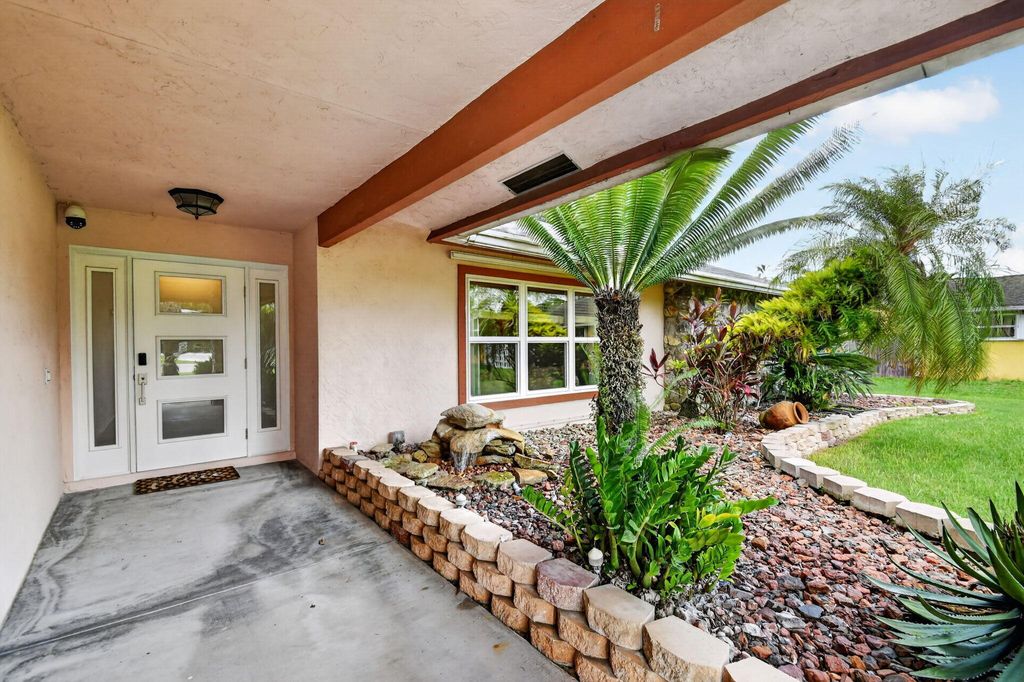 Photo of 93 Santa Monica Avenue, Royal Palm Beach, FL 33411 (MLS # B26053755)