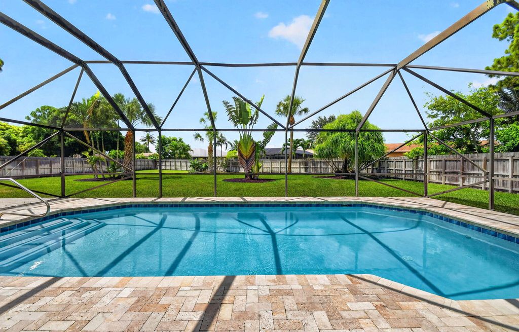 Photo of 93 Santa Monica Avenue, Royal Palm Beach, FL 33411 (MLS # B26053755)