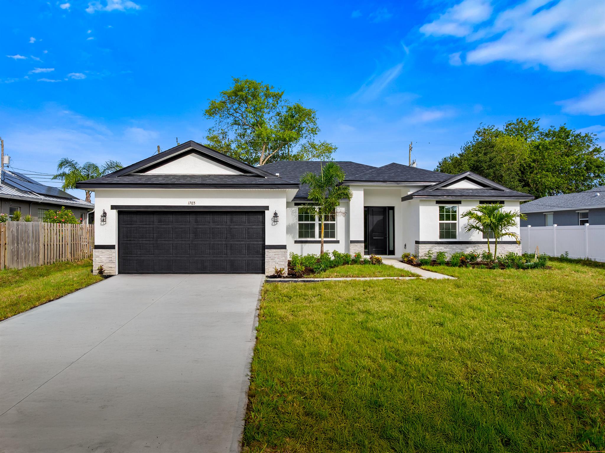 READY NOW AND OFFERING CLOSING COST INCENTIVES! This is a custom 5 bedroom 3 bath Shoreline model completely loaded is in the ''Pocket'' and area basically in Tradition with NO HOA AND NO CDD. This home comes with upgrades including impact window, wide plank tile throughout the home, calacatta quartz tops, 42 inch cabinets with soft close doors and drawers, tile backsplash, huge walk in shower in the master with frameless glass enclosure and upgraded oversize tile to the ceilings. This home was just finished and ready to move in!