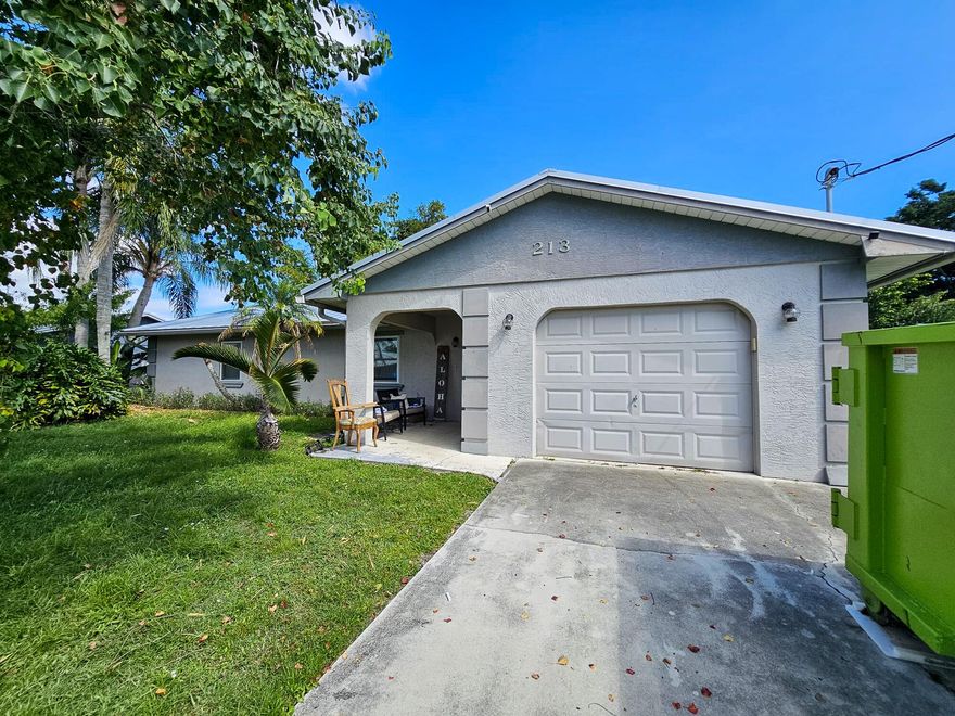 Charming 3-bedroom, 2-bath home with a 1-car garage and a metal roof (2022), ideally located in a quiet yet convenient Port St. Lucie neighborhood close to shopping, dining, and major roadways. This inviting home features two master suites, a bright open layout, and a dining area just off the kitchen. Enjoy peaceful canal views from the screened patio or relax in the fully fenced backyard with plenty of room to garden, play, or entertain. With a touch of TLC, this home can truly shine--perfect for investors or buyers ready to make it their own. Sold As Is.