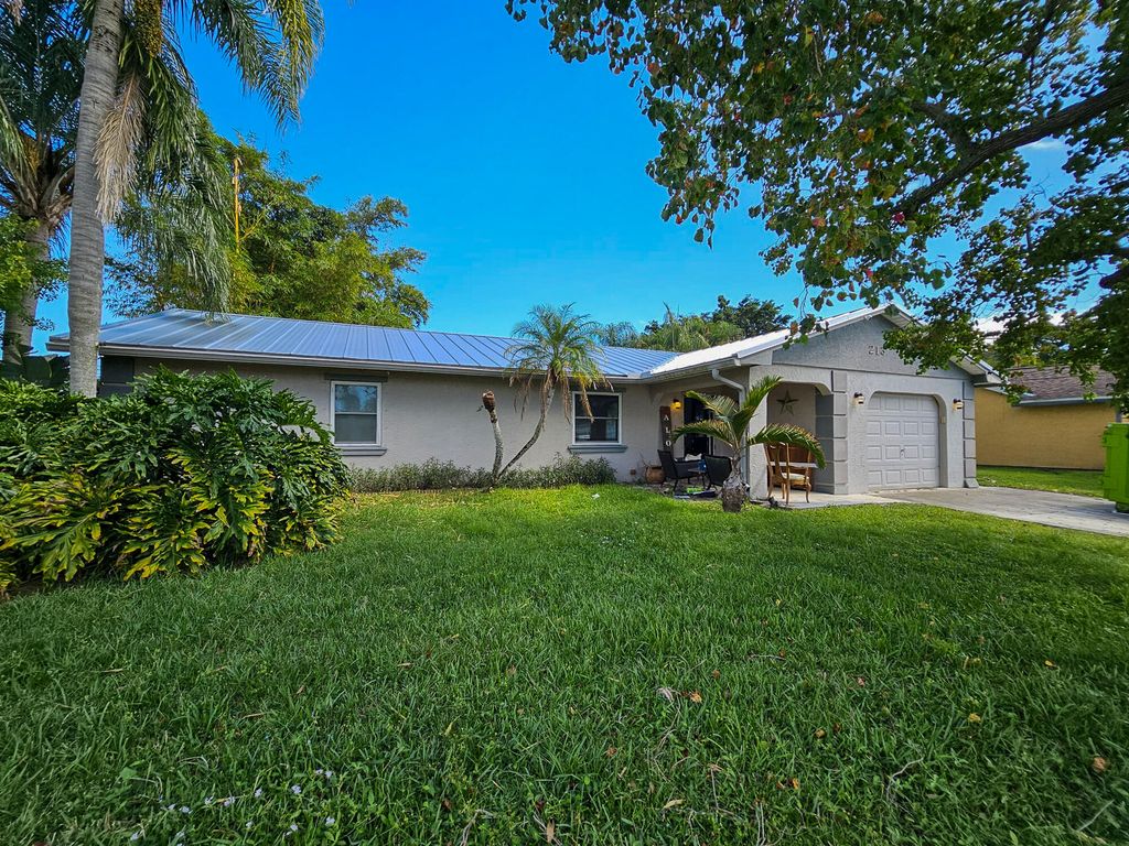 Photo of 213 SE Whitmore Drive, Port Saint Lucie, FL 34984 (MLS # R11137054)