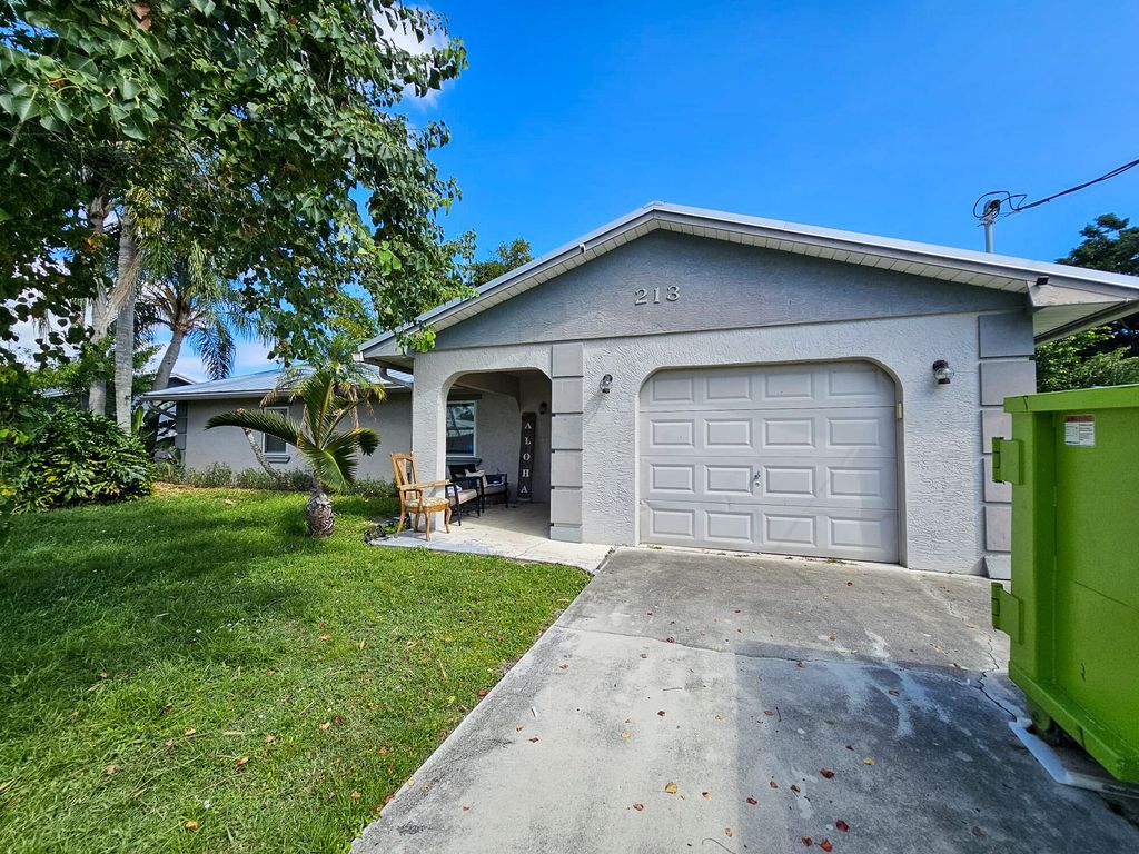 Photo of 213 SE Whitmore Drive, Port Saint Lucie, FL 34984 (MLS # R11137054)