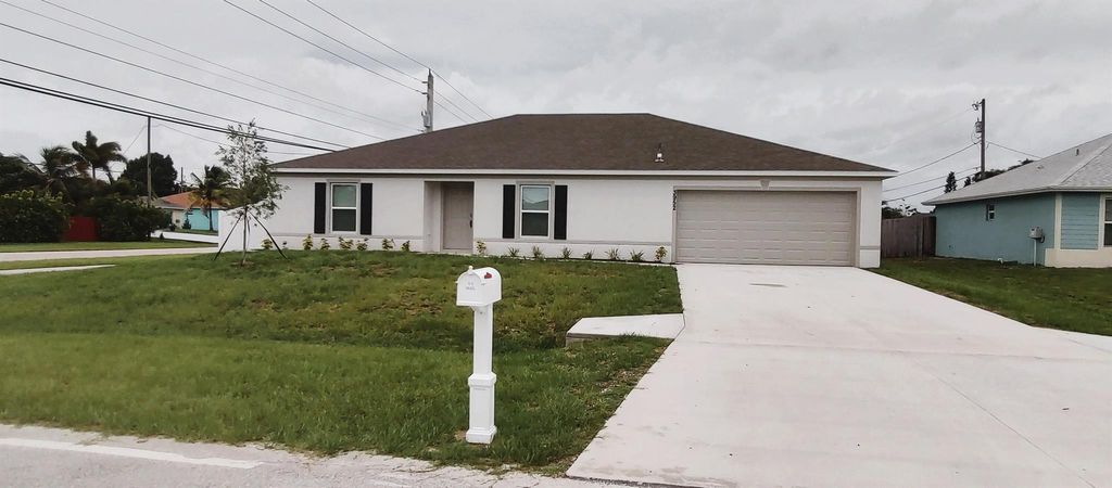 Photo of 3952 SW Kamsler Street, Port Saint Lucie, FL 34953 (MLS # R11010055)