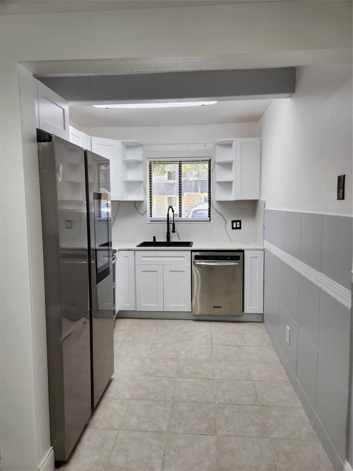 Beautiful 2/2 first-floor apartment. New flooring throughout the entire unit, including the bathroom and kitchen, features white shaker cabinets, quartz countertops, and a full backsplash in the kitchen, along with Samsung stainless steel appliances. Stackable washer and dryer inside the unit, water and trash collection included! 1 parking space + guest. Located just five miles from the sparkling shores of Pompano Beach, this property offers easy access to sun, sand, and surf. No pets allowed. Association approval required.