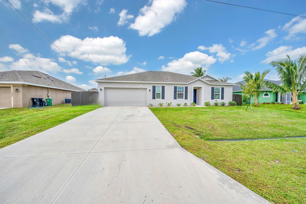 Photo of 1892 SW Monterrey Lane, Port Saint Lucie, FL 34953 (MLS # R10950767)