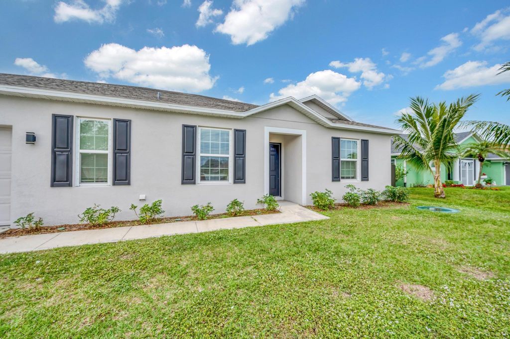 Photo of 1892 SW Monterrey Lane, Port Saint Lucie, FL 34953 (MLS # R10950767)