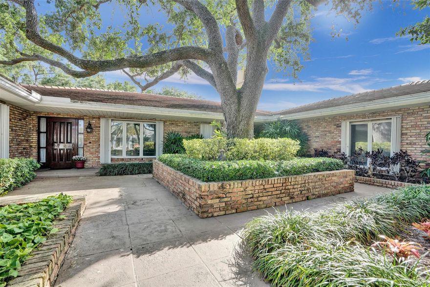 Located in the heart of the prestigious Coral Ridge Country Club community this home's southern exposure overlooks the 9th hole of the championship course.  Features include a 21,000 plus square foot lot, spacious open kitchen and living area with views of the pool and golf course, gorgeous wood floors, huge walk in closets, beautiful custom cabinetry throughout, volume ceilings with tongue and groove woodwork, hurricane shutters, generator and more! This property is perfect for remodeling or building the home of your dreams!