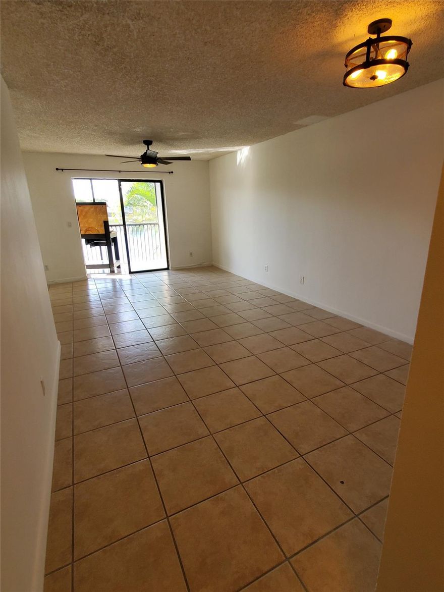 2 Bedroom/2 Bathroom QUIET second floor townhouse with Beautiful lake view that will be nice to wake up to every morning.  Unit is clean and very livable.  Nice for Owner occupied residence or investment property.  New Balcony for this subject unit with the Association in the process of getting approved milestone inspections.  Easy and ready to show, vacant with lockbox.  Prospective Buyer should have preapproval.  Seller wants to SELL!