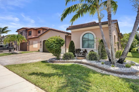 Photo of 11405 Solstice Circle, Parkland, FL 33076 (MLS # B26045455)