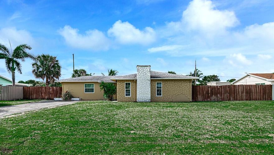 LAND!! LAND!! LAND!! The home needs a little touch up here and there. This home has impact windows and doors. This is a great starter home for your buyer. the 4th bedroom is being used as a family/ den.  It also has a banana and coconut tree.  If you want privacy from the neighbors. THIS IS IT!! You can actually stay here for the next 30 years.  If you want to expand later for a growing family, you can do it here.  Where else will you find the space without paying an association fee.  Bring your buyer so they can see it for yourself.