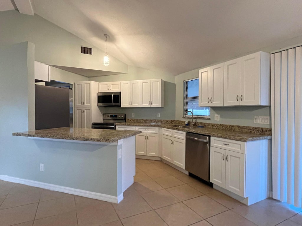 Photo of 1258 SE Mc Farlane Avenue, Port Saint Lucie, FL 34952 (MLS # B26056882)