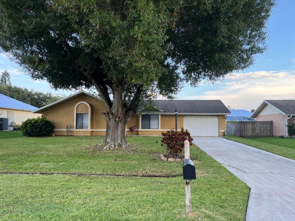 Photo of 1258 SE Mc Farlane Avenue, Port Saint Lucie, FL 34952 (MLS # B26056882)