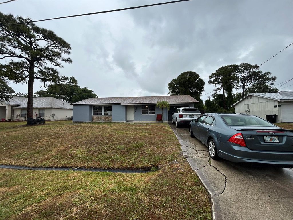 Photo of 213 SW Chapman Avenue, Port Saint Lucie, FL 34953 (MLS # R11090485)