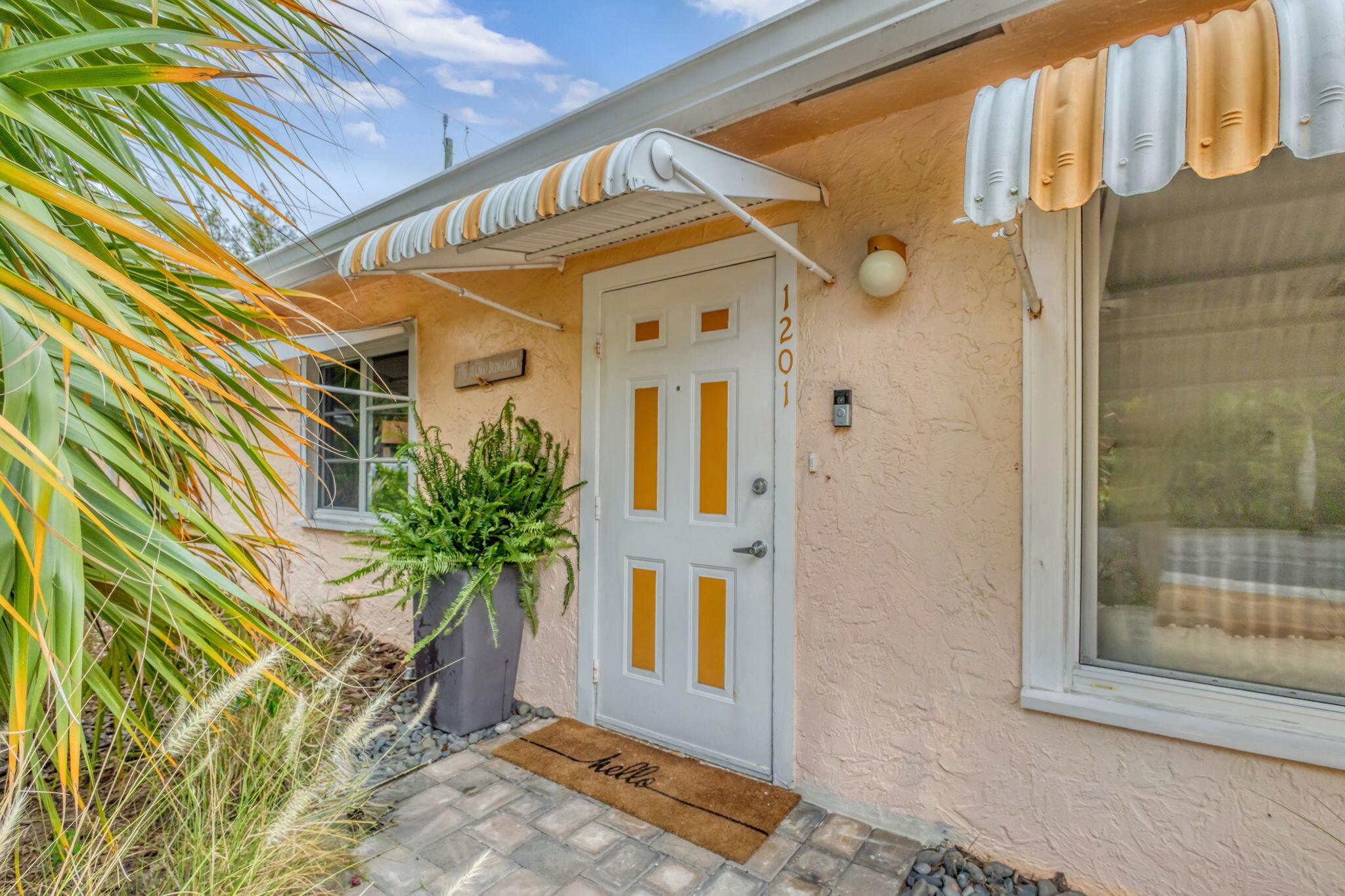 This charming 1925 bungalow is nestled into a double corner lot in the Mango Groves neighborhood and is just minutes from downtown Lake Worth Beach's cafes, art galleries and the oceanfront. The lot is fully fenced for privacy and is anchored by one of the oldest mango trees in the city. The expansive yard is your empty palette, only limited by your imagination, with plenty of room for a pool, gardens, or an addition to the home. Create your own private oasis! The spacious 3 bedroom, 1 bath home is light and bright and has an open floor plan, impact windows throughout, giving you peace of mind, new central A/C in 2024 and a new roof in 2021. Make this historic property your own. Hip and artsy downtown Lake Worth Beach and its sidewalk cafes, galleries and specialty shops are