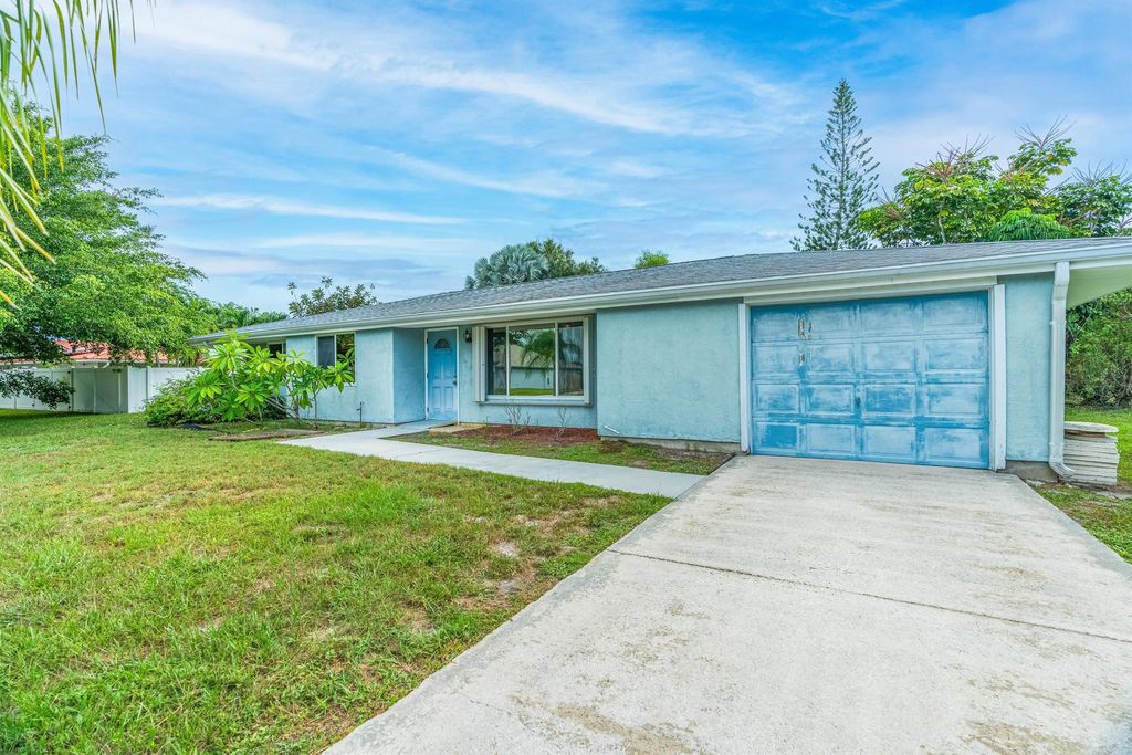 Photo of 150 NE Lima Court, Port Saint Lucie, FL 34983 (MLS # R11015723)