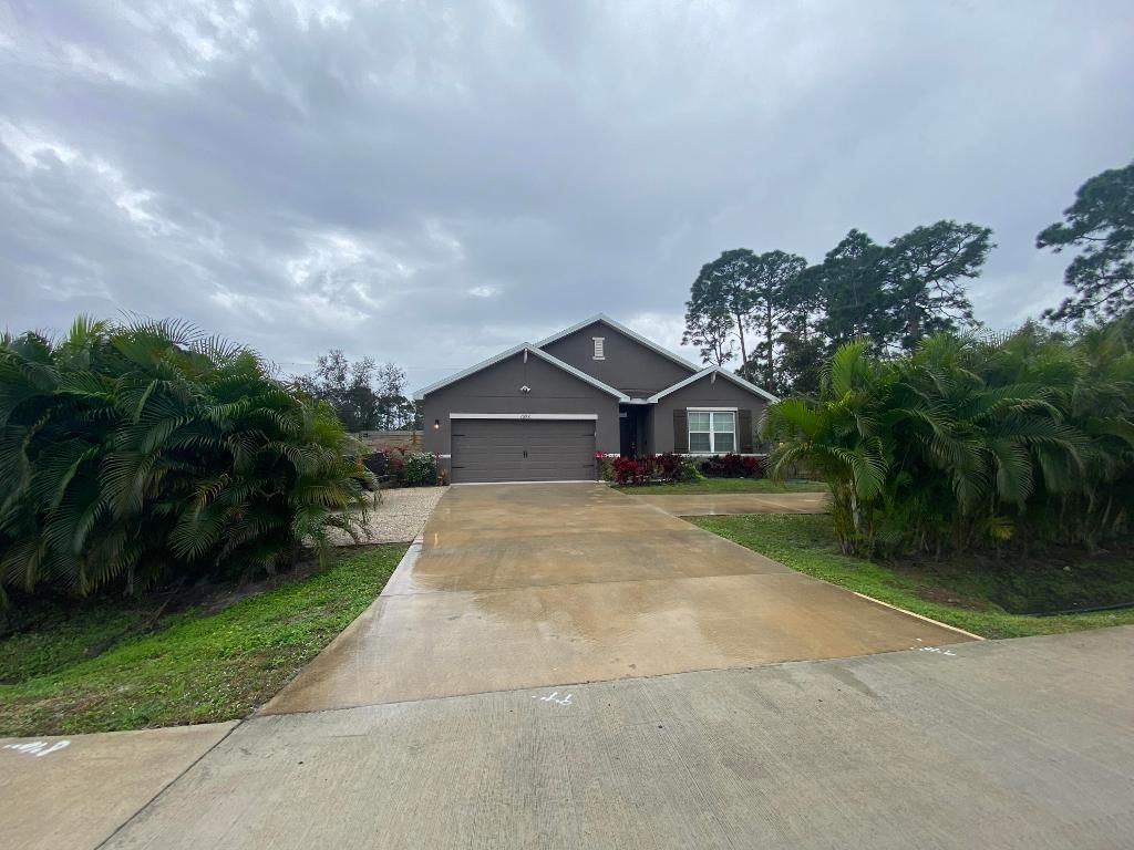 Photo of 1596 SW Paar Drive, Port Saint Lucie, FL 34953 (MLS # R10952598)