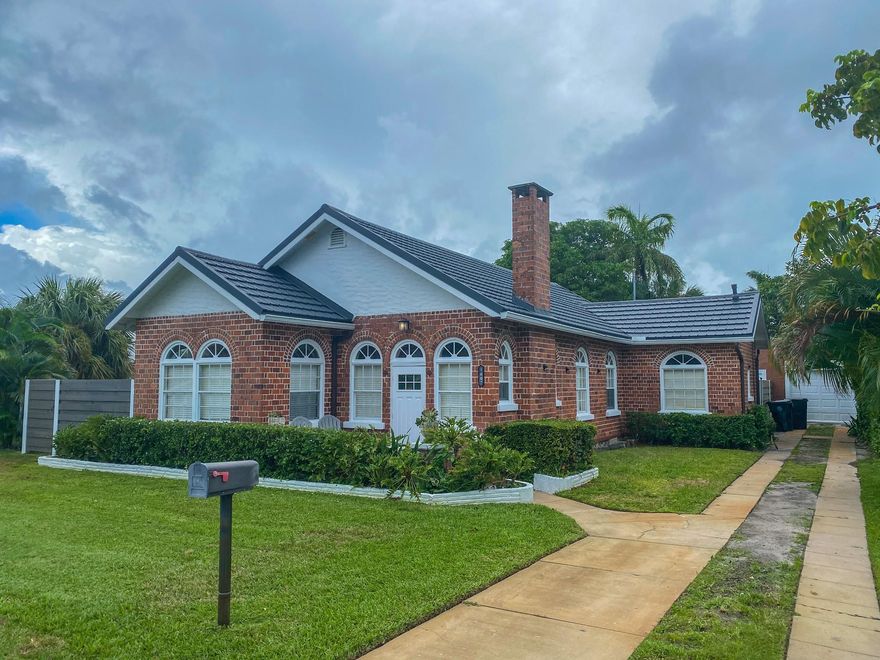 Step into this charming 1920s cottage where character meets modern comfort. With 3 spacious bedrooms & 2 updated bathrooms, this home offers a blend of vintage charm & modern convenience. The master features a large, renovated en-suite bath, while 2 add'l bedrooms share a spacious, updated bathroom. The open layout makes living & entertaining easy, with natural flow bw the kitchen, dining, & living spaces. Outside, enjoy a true Florida lifestyle in the large, fully fenced yard with 6-foot privacy fence, fire pit, & outdoor dining area. A screened patio offers a shaded escape, while the 1.5-car garage provides plenty of storage. Nestled on a private lot in the heart of Lake Worth Beach, this home offers both tranquility & convenience.