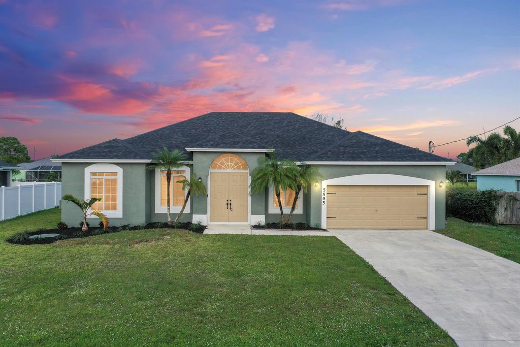 Photo of 5595 NW Wesley Road, Port Saint Lucie, FL 34986 (MLS # R10938846)