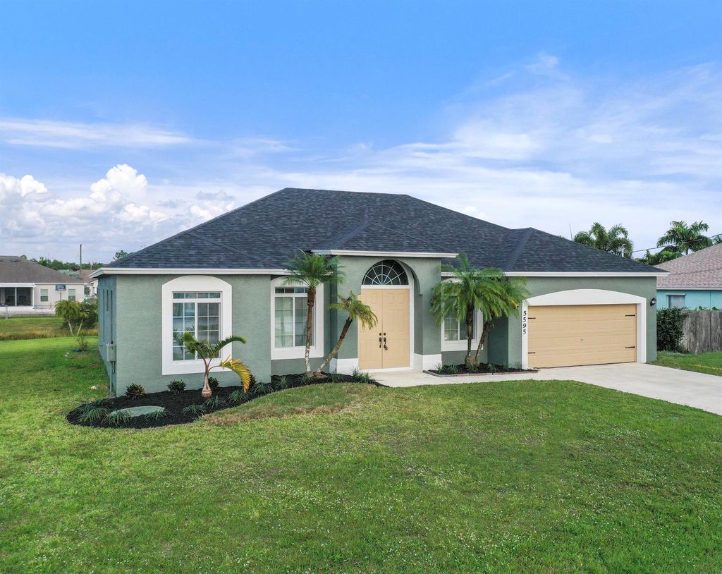 Photo of 5595 NW Wesley Road, Port Saint Lucie, FL 34986 (MLS # R10938846)