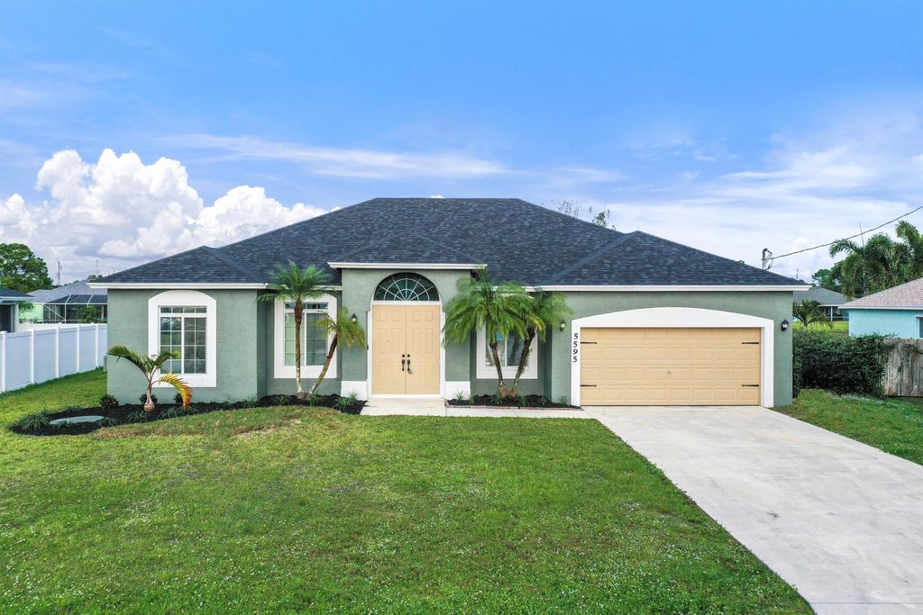 Photo of 5595 NW Wesley Road, Port Saint Lucie, FL 34986 (MLS # R10938846)