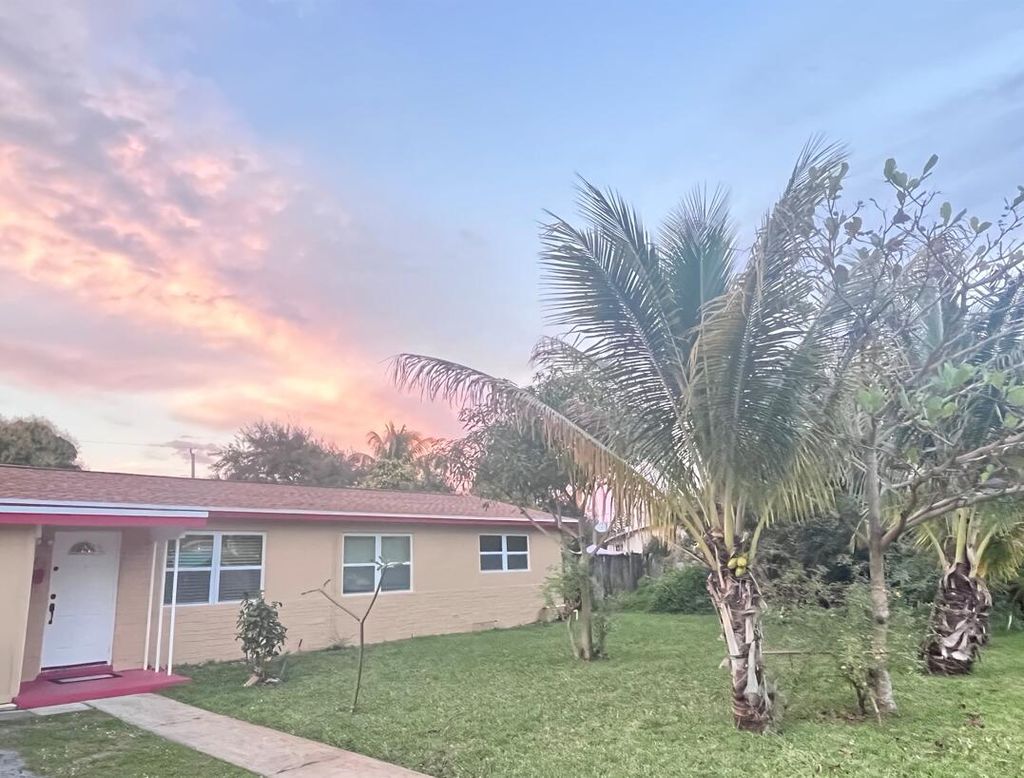 Photo of 823 Magnolia Drive, Lake Park, FL 33403 (MLS # R10775892)