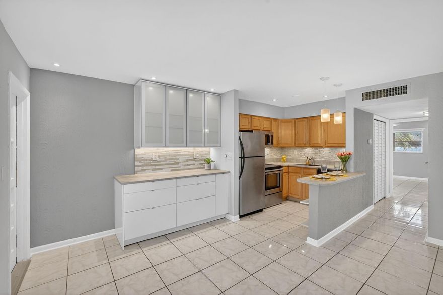 Spacious, beautifully renovated 2-bed, 1-bath condo in the heart of Oakland Park. Great investment property, can rent right away, low monthly Maintenance fee, walk-in closets, dimmable recessed lighting, ceiling fans, and central A/C system. The stylish open kitchen, stainless steel appliances, brand-new cabinetry, decorative glass tile accents, and sleek under-cabinet lighting, creating the perfect space for entertaining. Enjoy on-site common laundry, a community pool, and a dedicated entertainment/party area for gatherings. The property also includes two assigned parking spaces plus additional guest parking. Ideally located within walking distance to Funky Buddha, Downtown Oakland Park, JACO, and Greenleaf Park, this condo offers unbeatable convenience