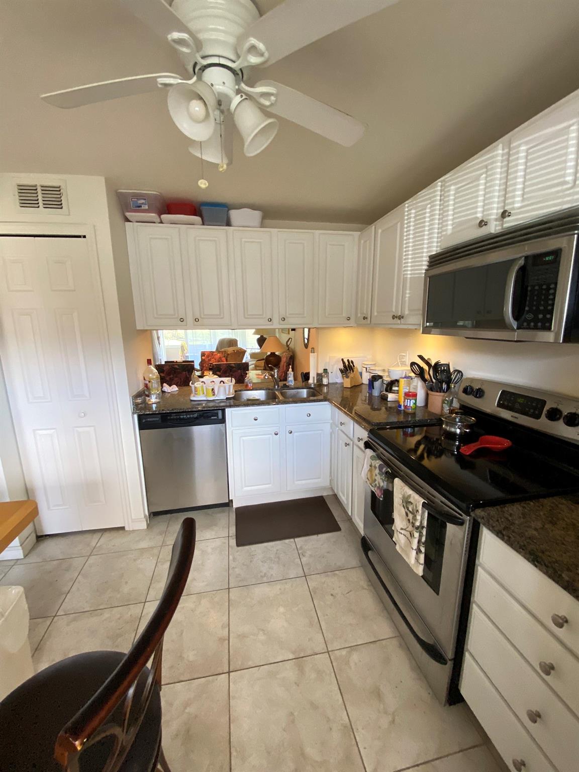 First floor condo in the Greens of Tamarac. Brand new air conditioning. Newer kitchen with granite tops. Large pantry. Both bedrooms have large walk in closets. This unit is being sold furnished with everything that is currently there. Great view of the lake from the patio. Tile/laminate flooring throughout. This is a 55+ community. There is a heated pool, shuffleboard, horseshoes, community room, and billiard room.