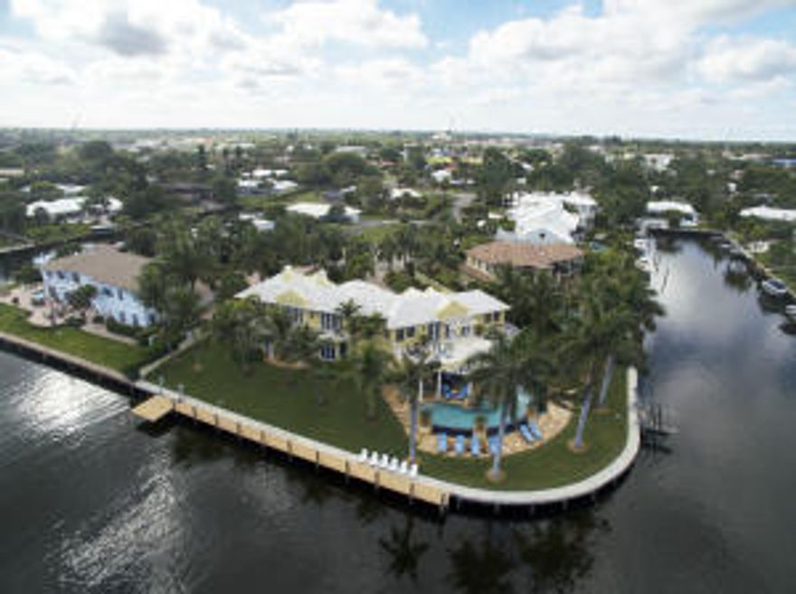 Spectacular, wide water views abound from this Gulf Stream, direct Intracoastal point lot with 253'of waterfront overlooking the Gulf Stream Golf Club. This magnificent estate home offers 5 bedrooms, 6.1 baths and 3-car garage and has been recently completely remodeled by a professional decorator. Features include formal living and dining rooms, a large clubroom, and a gourmet kitchen equipped with top of the line appliances that is open to a casual living space. A spacious Master suite has his and her baths, sitting area, coffee bar and a wall of French doors leading to an expansive terrace with sweeping water views. The four other bedrooms are all ensuite and three have water views from outdoor terraces. The living space is expanded by a large covered patio that is perfect for