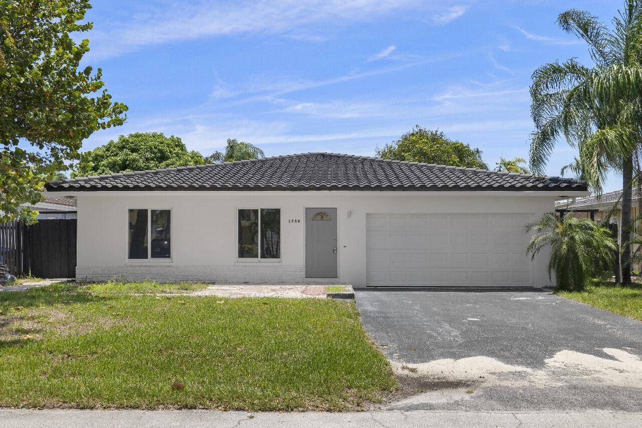 Just 3-4 weeks away from full completion, this fully renovated single-story pool home in the heart of Coral Ridge Isles offers a rare combination of style, function, and strategic long-term value. With 1,832 square feet of intelligently designed living space, three bedrooms, and three full bathrooms--including a newly added third bath--this residence is crafted for those who value clarity, comfort, and confidence in their real estate decisions.From the moment you enter, the home flows effortlessly. Large-format tile flooring runs throughout, and impact windows and sliding doors connect the spacious interior to an inviting outdoor sanctuary. The open-concept layout was built for real life--ideal for entertaining, unwinding, or just enjoying the day-to-day with ease.