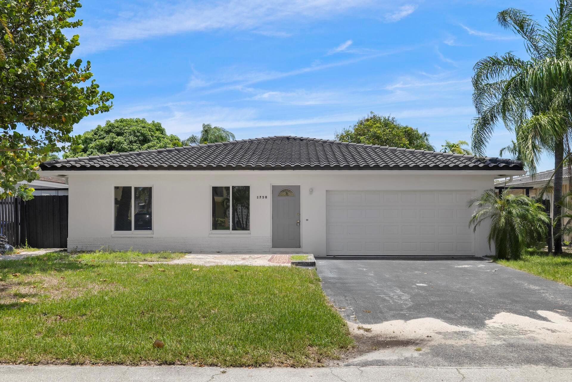 Just Weeks from Completion. Designed for Today. Positioned for Tomorrow.Now in the final stages of a full-scale transformation, this single-story pool home in the heart of Coral Ridge Isles offers a rare blend of style, substance, and long-term upside. With 1,832 square feet of thoughtfully reimagined living space, three bedrooms, and three full bathrooms including a newly added third bath this residence has been fully updated with elevated finishes and a focus on functional, modern living.From the moment you enter, the flow is effortless. Large-format tile flooring runs throughout, while new impact-rated windows and sliding doors create a seamless connection between indoors and out.