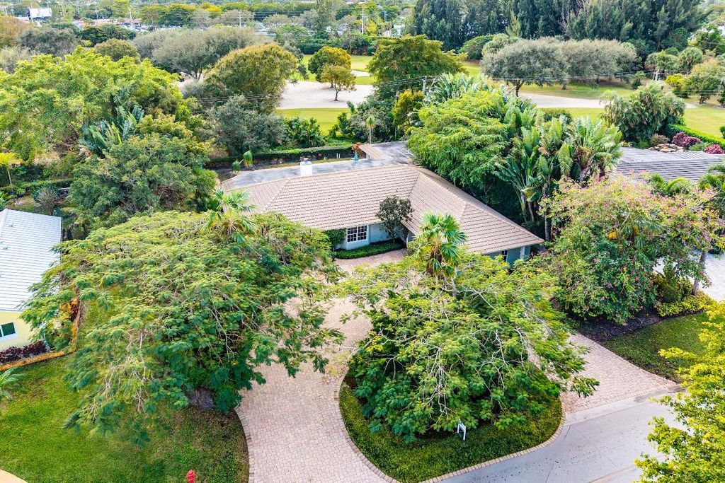 Photo of 416 S Country Club Drive, Atlantis, FL 33462 (MLS # R11158104)