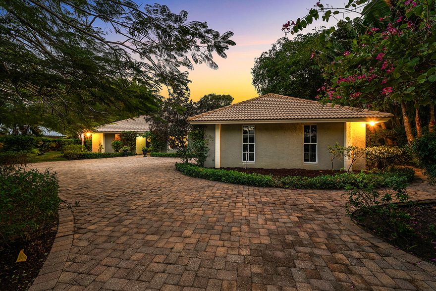 WOW! Endless possibilities await at 416 S Country Club Drive, ideally located in the heart of the non-HOA golf community of Atlantis. Situated on an expansive ~0.40-acre lot & perfectly positioned on the golf course, an oversized paved driveway welcomes you to a double-door entry. The open-concept layout, enhanced by wall-to-wall windows and sliders, creates a bright, airy atmosphere throughout your 3777 Liv SF. This residence offers the rare advantage of two primary retreats - One features a sprawling bedroom with ample space for a sitting area, office, or home gym, along with an oversized walk-in closet. The second primary is positioned on the opposite side of the home, poolside, complete with a cabana bath and direct slider access to the backyard. Enjoy southern exposure over the pool and generous green space - perfectly suite for entertaining, pets, and family living. A true 4-bedroom, 3-bath home with a 2-car garage, all hurricane-impact windows, and endless potential ready for its next proud owner. A must see.

Nestled in the heart of Palm Beach County, the City of Atlantis is a unique, non-mandatory country club, gated community renowned for its quiet elegance, safety, and resort-style lifestyle. At the center of it all is The Lost City Golf Club - a private, 27-hole championship course known for its pristine fairways and welcoming yet refined atmosphere. Home to fewer than 2,500 residents, Atlantis is cherished for its privacy, lush landscaping, and two golf courses that wind gracefully through the community, offering rolling greens, shimmering lakes, and mature trees.