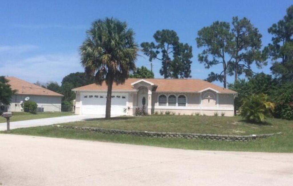 Photo of 101 NW Carmelite Street, Port Saint Lucie, FL 34983 (MLS # R10954596)