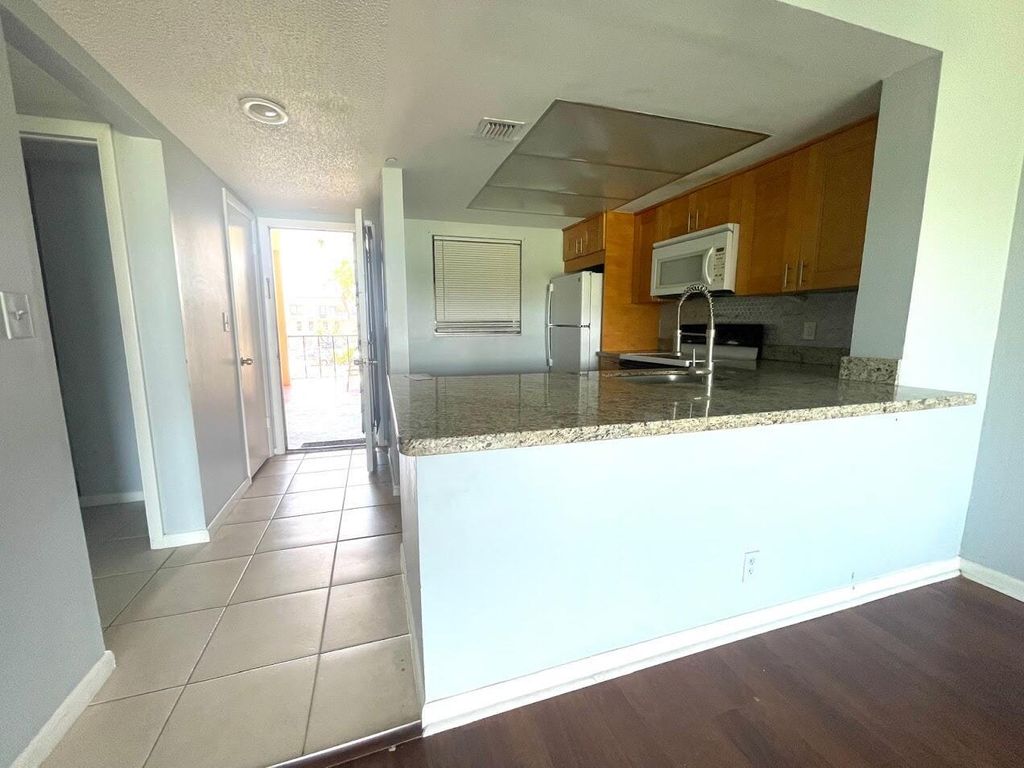 Photo of 1101 Crystal Lake Drive #205, Pompano Beach, FL 33064 (MLS # R11095166)