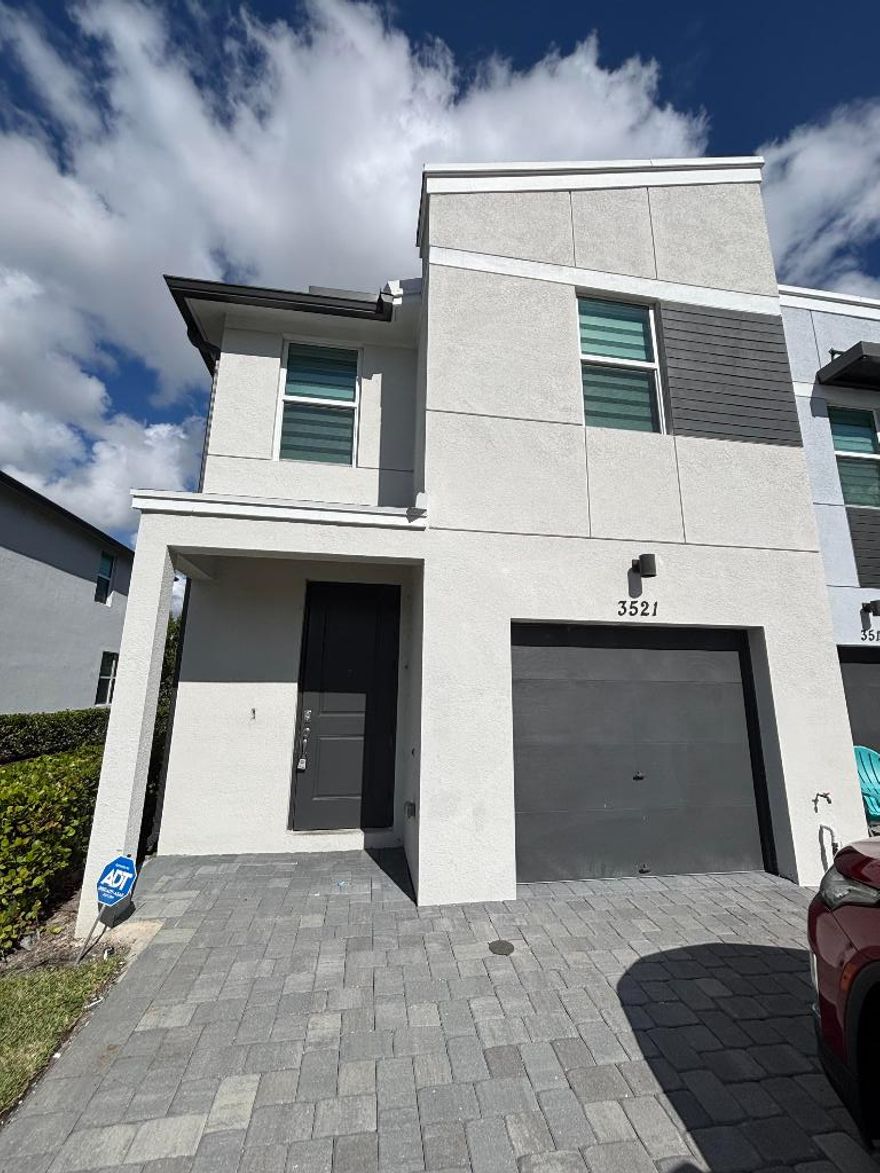 Modern rental home built in 2022 featuring 3 bedrooms and 2.5 bathrooms with an attached garage. Washer and dryer conveniently located upstairs. The primary suite offers two walk-in closets. All windows are impact glass. This well-designed residence features bright living spaces, contemporary finishes, and ample storage. Located in Lake Worth and close to beaches, shopping, dining, and major roadways. Comfortable, low-maintenance living, schedule your showing today.